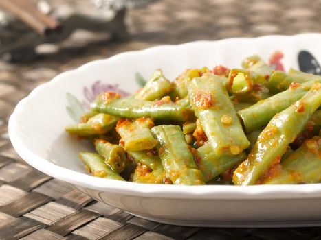 close up of a plate of stir fried long beans in chili shrimp paste