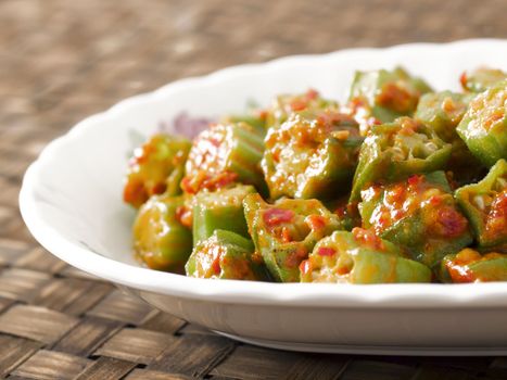 close up of a plate of stir fried okra in chili shrimp paste