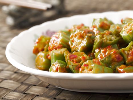 close up of a plate of stir fried okra in chili shrimp paste