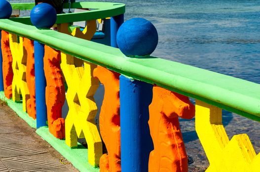 Brightly colored rail on a bridge in San Andres y Providencia, Colombia