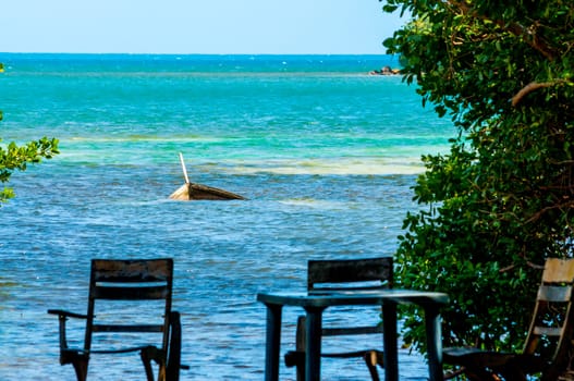 Sunken boat with chairs in San Andres y Providencia, Colombia