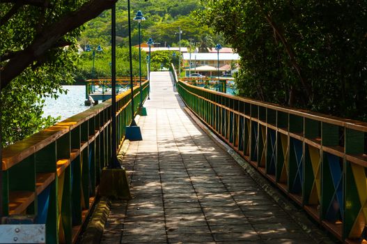 Shady bridge in Caribbean Sea connecting islands of Providencia and Santa Catalina in Colombia