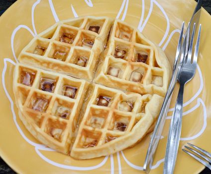 Round waffle with syrup on dish, Dessert concept
