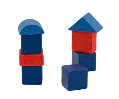 colorful red blue wooden log toy tower constructions stand isolated on white.