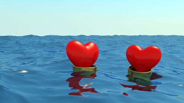 Hearts in gold wedding rings float at the ocean on a meeting each other.