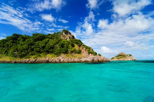 Beautiful deserted island surrounded by turquoise blue water in the Caribbean Sea