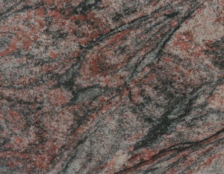 Surface of the granite with black, red and brown tint for background