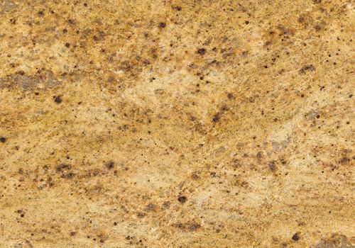 Surface of the granite with yellow, gold and brown tint for background