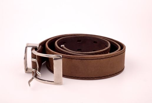 Leather trouser belt brown color on a white background