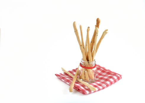 bread sticks in glass bottle