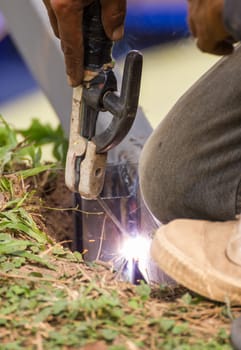 Welder welding  elements at the  construction site