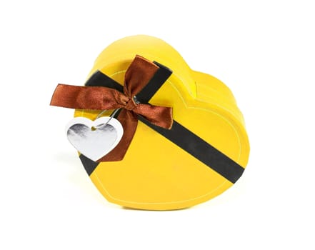 Yellow Heart-shaped box in heart shape on white background