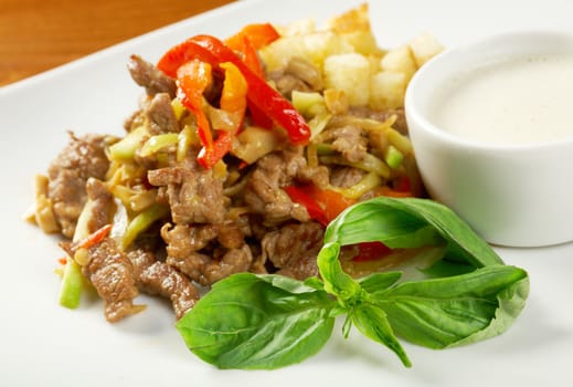 Italian cuisine.healthy salad  with meat ,cracker and basil