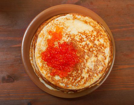 Traditional Russian pancakes  with red caviar