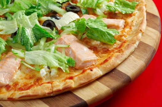 Pizza Atlantic salmon . italian kitchen. Studio