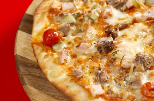 Pizza east with tomato. italian kitchen. Studio