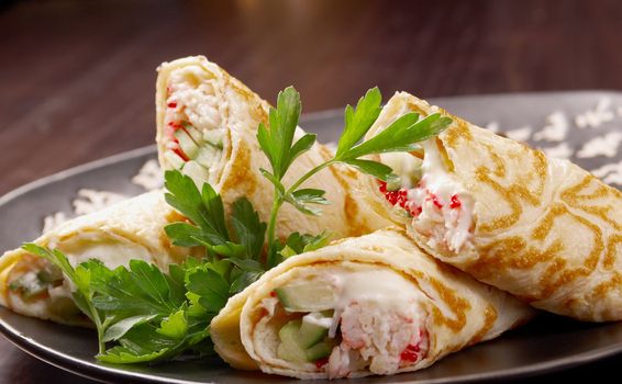 rolled pancakes stuffed . Shallow depth-of-field.