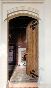 Open door into the vestry or sacristy inside an Edward Pugin design church