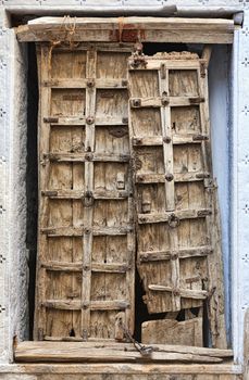 Old dilapidated wooden door. Rajasthan, India