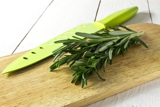 Fresh rosemary on chopping board