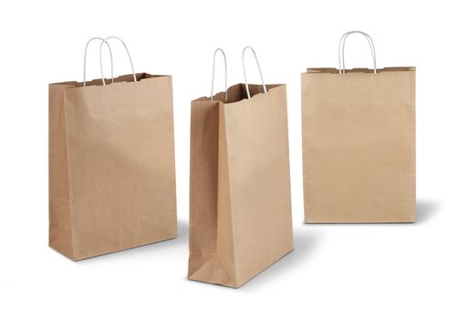 Three brown shopping paper bags isolated on white background