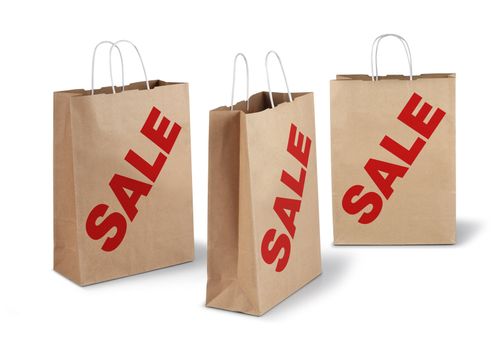 Three brown shopping paper bags red sale text isolated