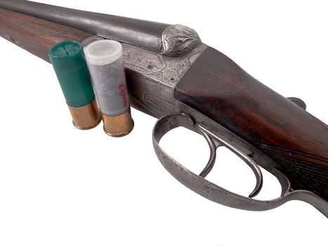 two shells and old double barrell shotgun