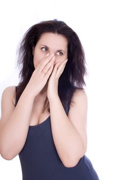 Scared woman hiding herself in her hands, isolated on white.