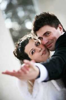 Dance of a newly-married couple in park