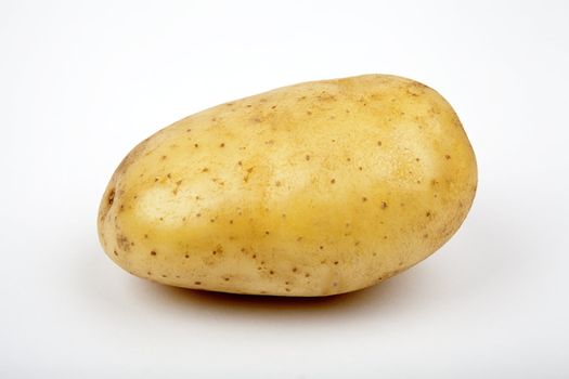 A solitary Potato on a white background.