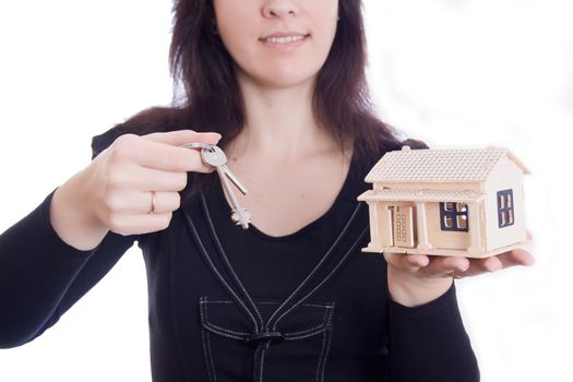 Picture of woman's hands holding house and keys