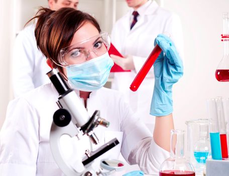 chemist working in the laboratory, mix liquid