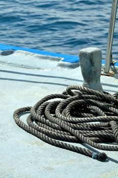Old Dirty  Mooring Rope on Ship Deck on ocean background