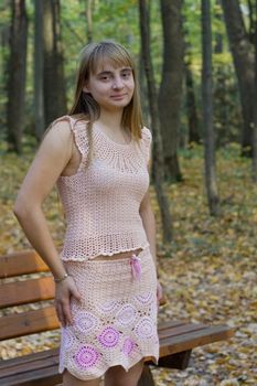 Portrait of the beautiful girl in autumn forest. 