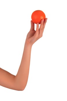 Woman's hands with orange isolated over white background