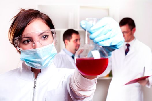 chemist working in the laboratory, mix liquid