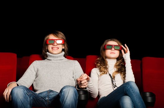 young couple in the cinema to enjoy the movie