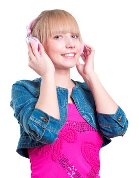 Young attractive woman listing to music with headphones against white background