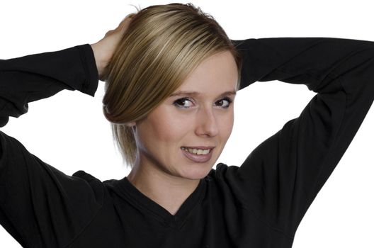 portrait of a young woman holding her hair up on white background