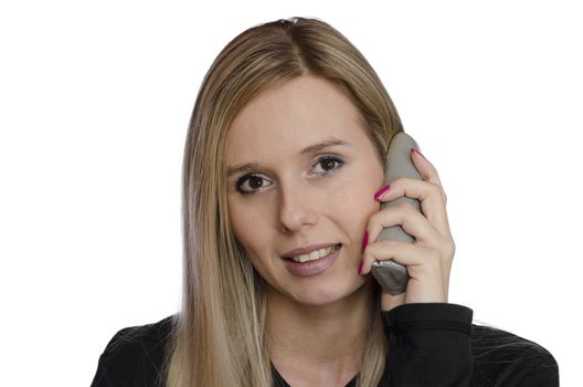 young woman talking on the phone smiling on white background