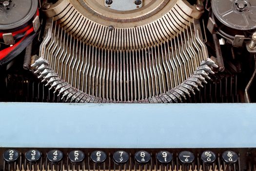 retro typewriter close up with number keys and letters mechanism