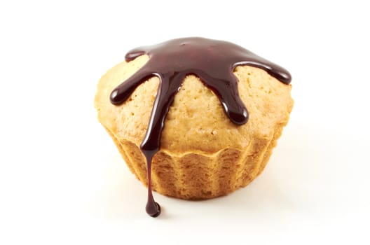 Cake covered with chocolate glaze on a white background