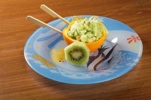 Fruit salad oranges studded for child
