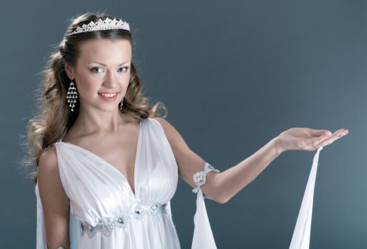 Beautiful young female wearing white dress in antique style  .Like goddess