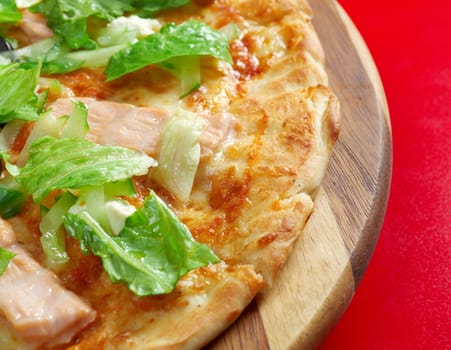 Pizza Atlantic salmon . italian kitchen. Studio