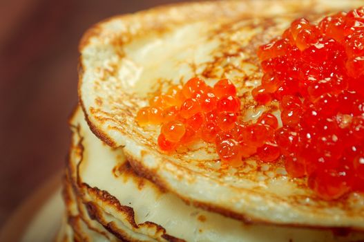 Traditional Russian pancakes  with red caviar