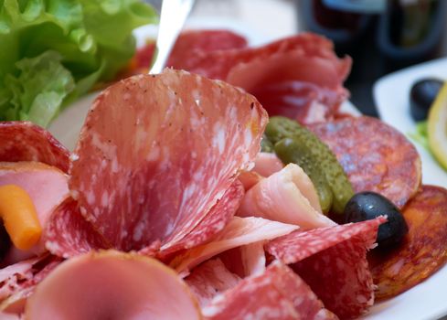 Beautiful sliced meat arrangement. Shallow depth-of-field