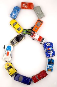 Figure eight of destkih toy cars on a white background