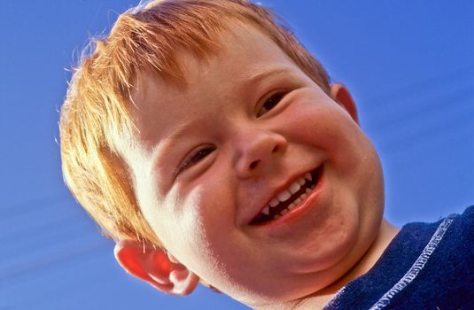 cute happy laughing young boy