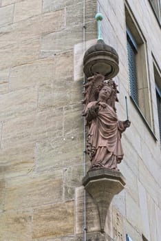 Statue of an angel on the house in the center of Nuremberg, Germany
